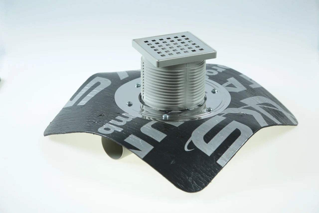 Double-body drain 10*10 cm with a pressure flange and a bitumen membrane, horizontal. output D50, dry shutter 5021.MY050.10.1