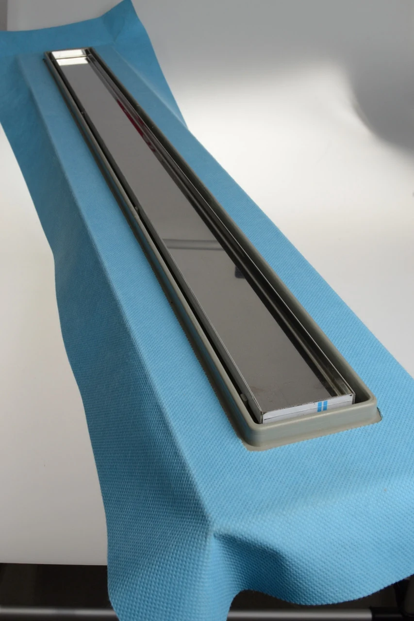 Linear drain with horizontal flange, 33 cm rain grate, shower channel with side outlet Linear drain with horizontal flange, 33 cm rain grate, shower channel with side outlet
