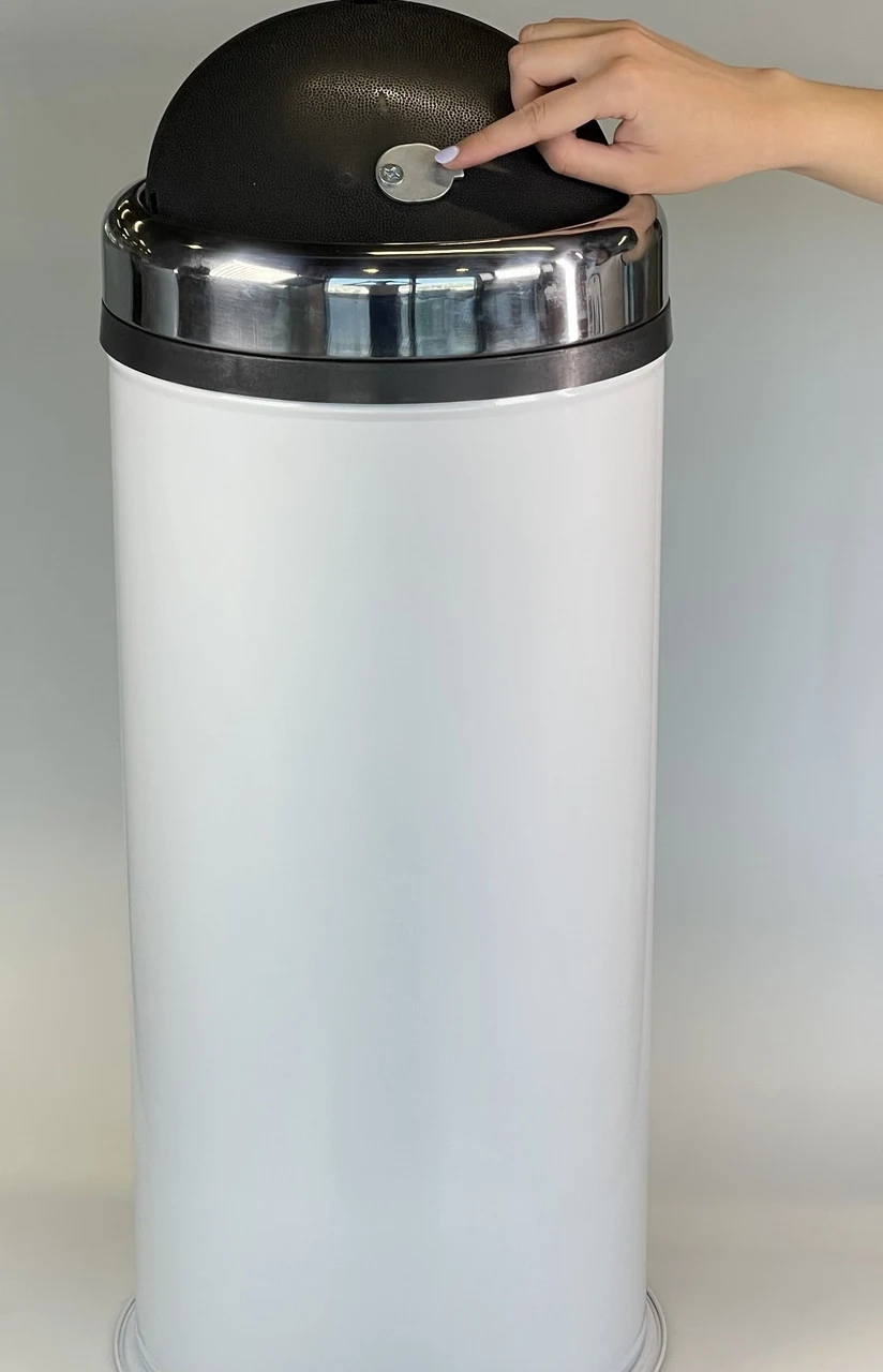 Round trash can with rotating stainless steel lid and rim 45 liters white