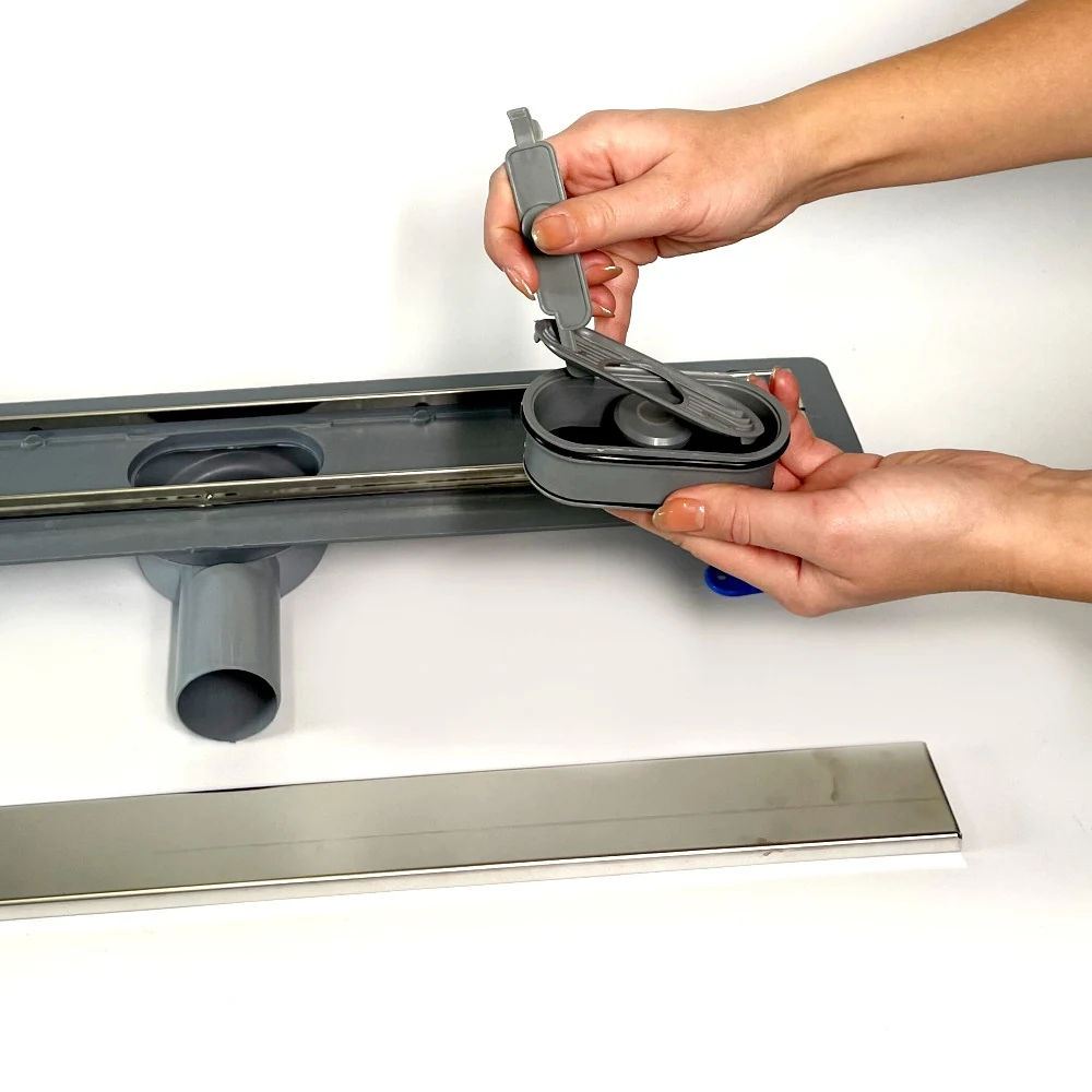 Shower drain with 360 swivel siphon, “UNDER TILE” grate 60 cm, stainless steel edge Shower drain with 360 swivel siphon, “UNDER TILE” grate 60 cm, stainless steel edge