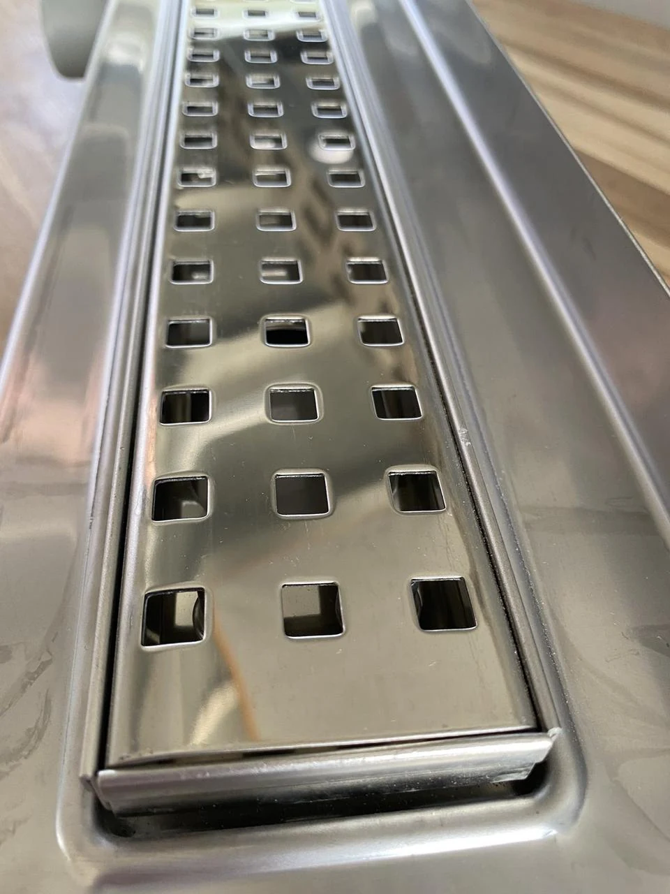 Shower drain with a stainless steel body with a horizontal flange, “Square” grate 80 cm. Shower drain with a stainless steel body with a horizontal flange, “Square” grate 80 cm.