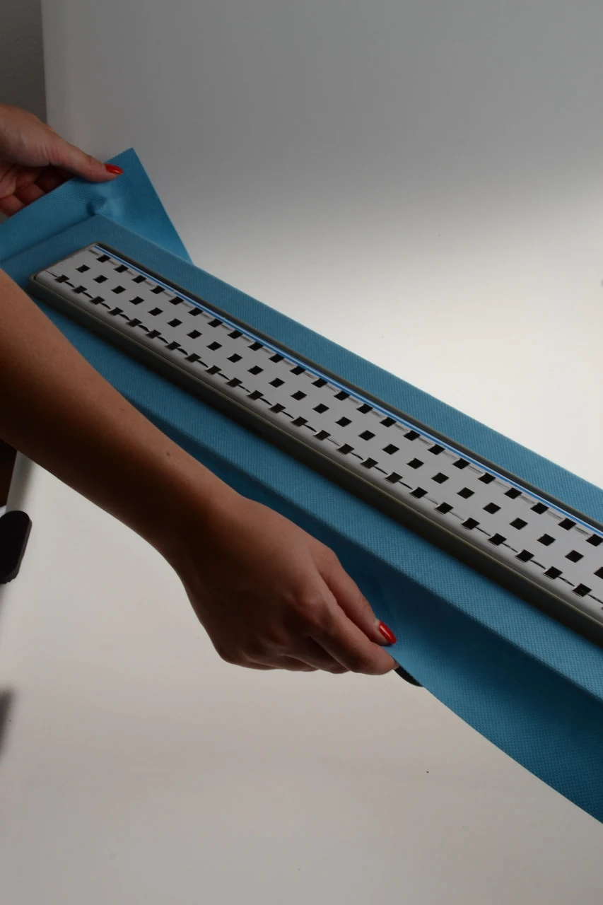 Shower drain with horizontal flange, 60 cm square grate, shower channel with double water seal Shower drain with horizontal flange, 60 cm square grate, shower channel with double water seal