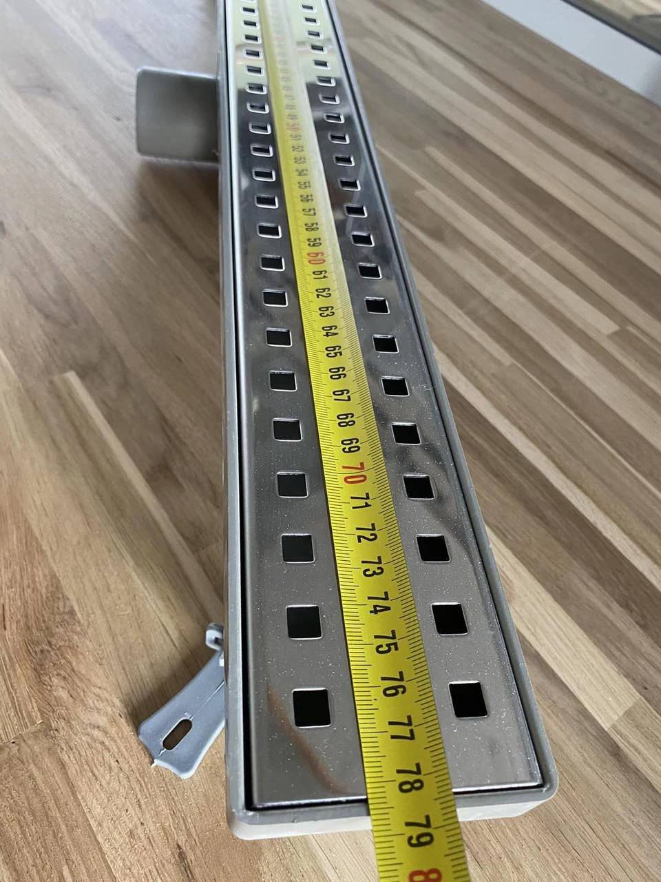 Shower drain with horizontal flange, 60 cm square grate, shower channel with double water seal Shower drain with horizontal flange, 60 cm square grate, shower channel with double water seal